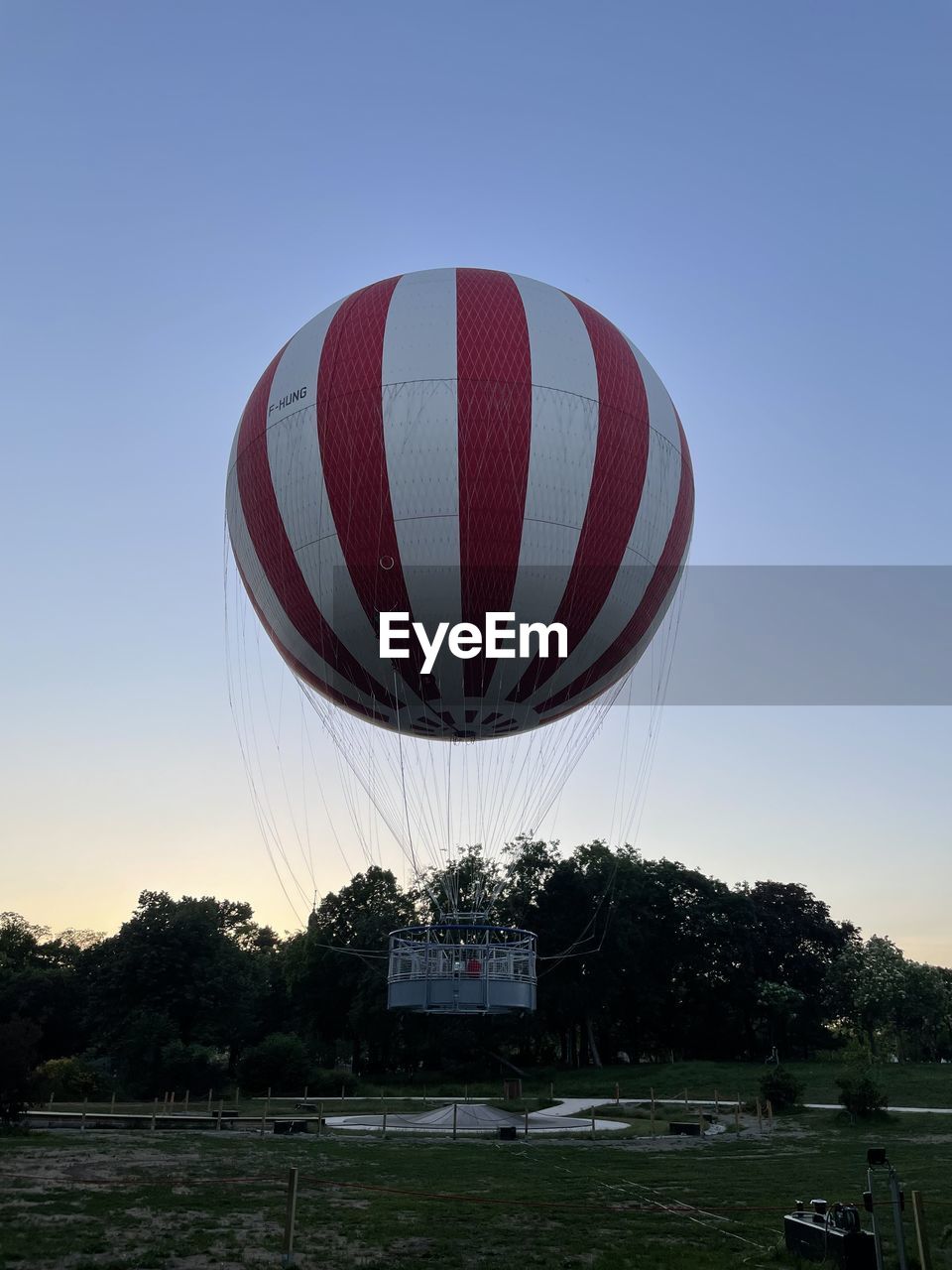 hot air balloon, sky, aircraft, nature, vehicle, clear sky, blue, hot air ballooning, sports, no people, day, transportation, tree, outdoors, plant, low angle view, air vehicle