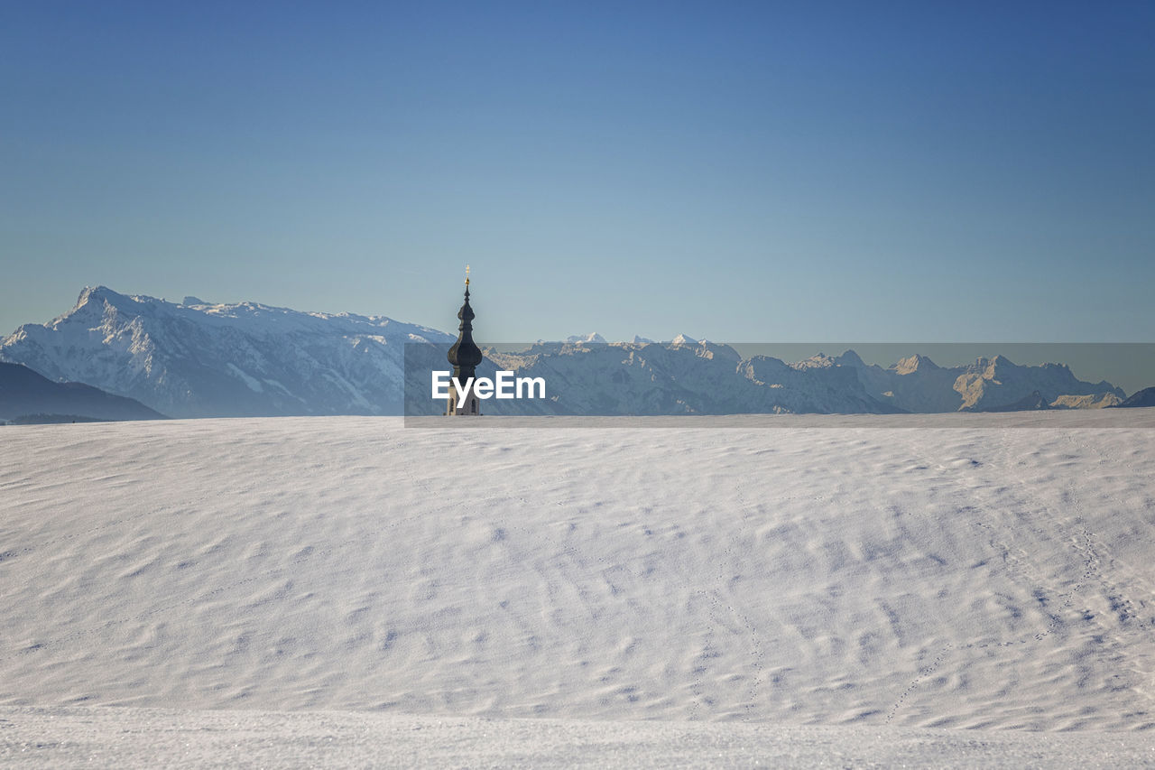 Scenic view of snowcapped mountain against clear sky
