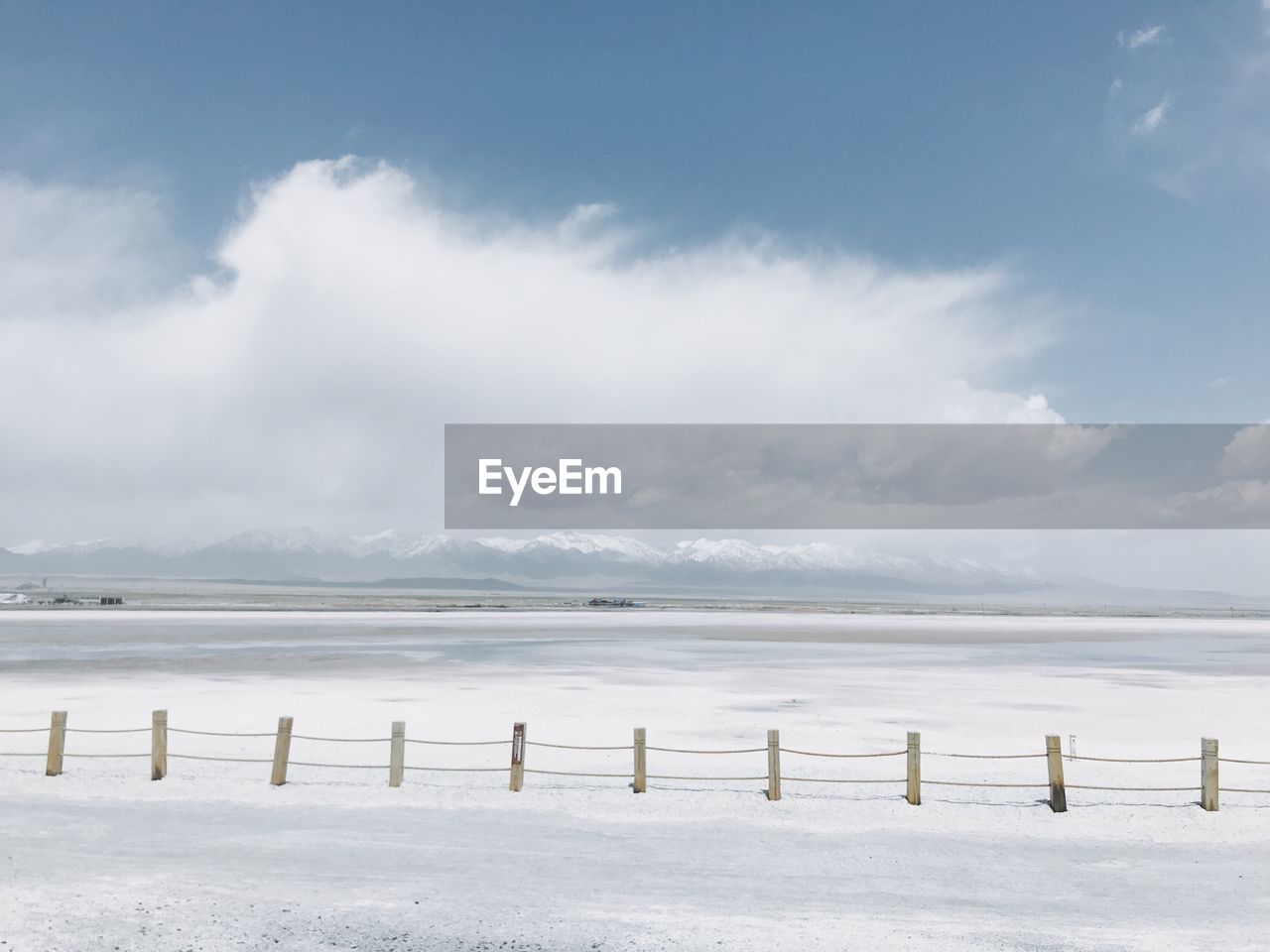 Scenic view of salt lake against sky