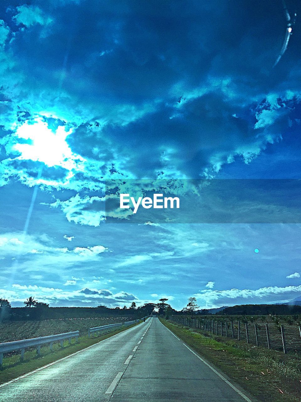 ROAD PASSING THROUGH LANDSCAPE