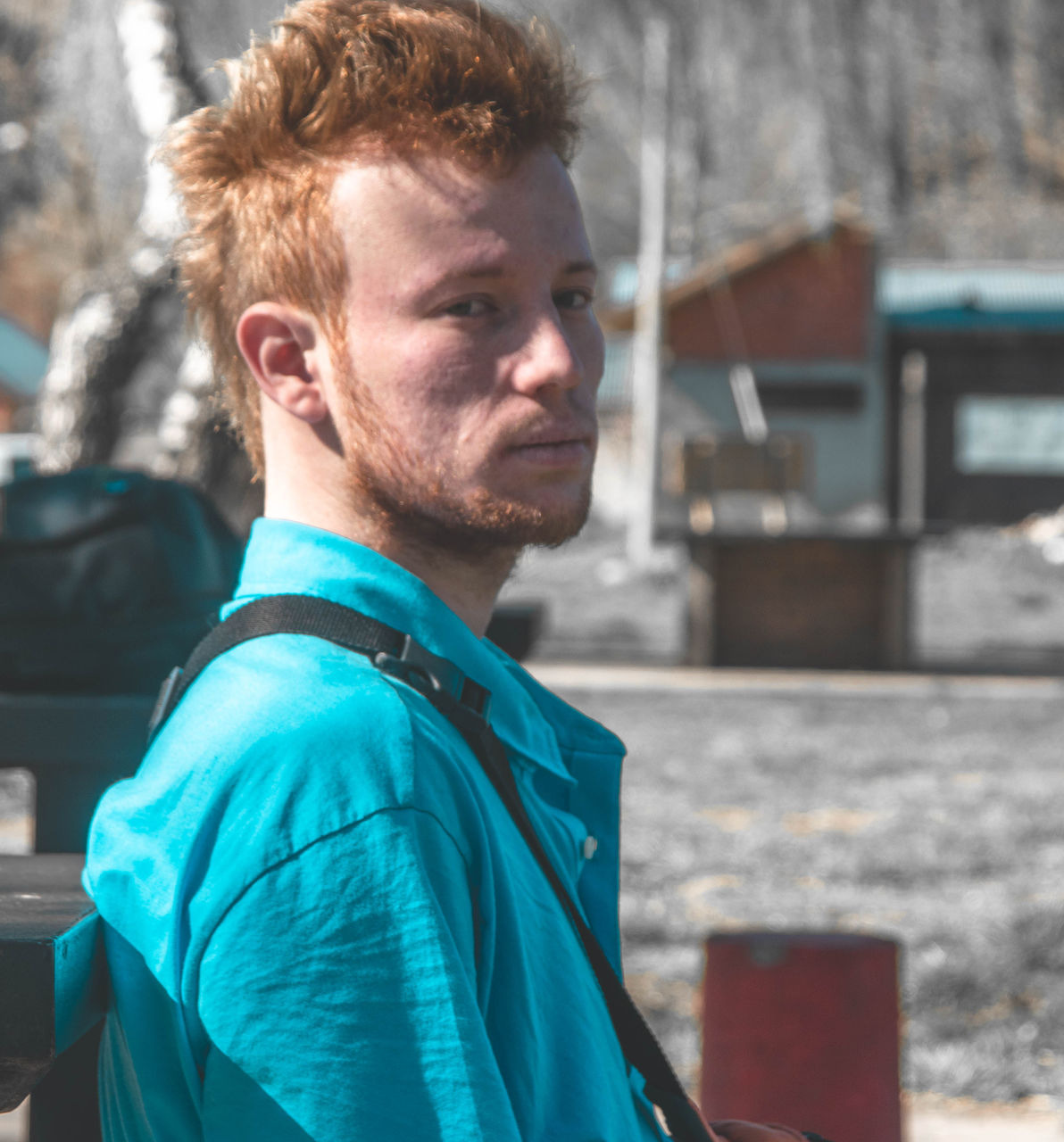 Portrait of young man standing outdoors