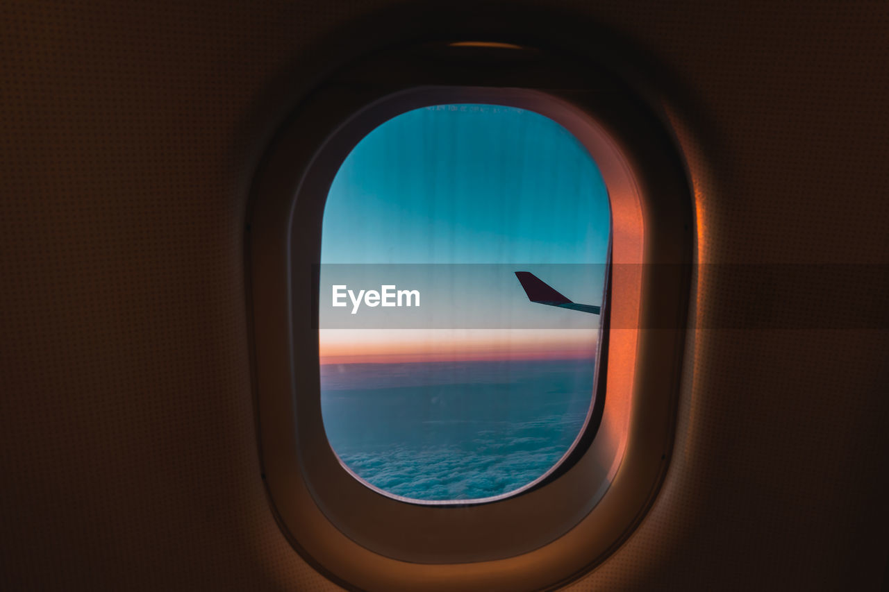 SEA SEEN THROUGH AIRPLANE WINDOW