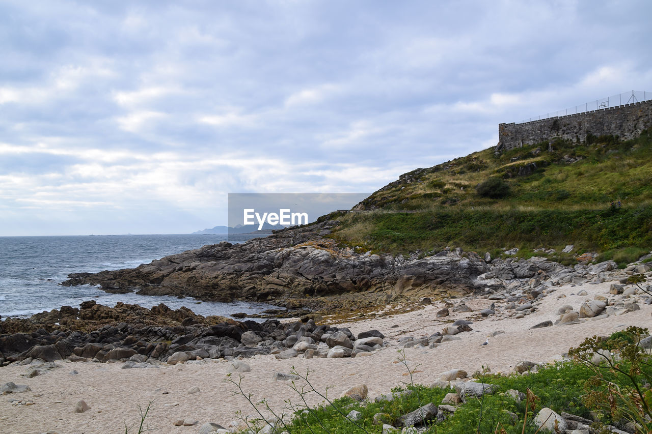 View of the beach of os frades in baiona - spain. small beach located next to the fortress 