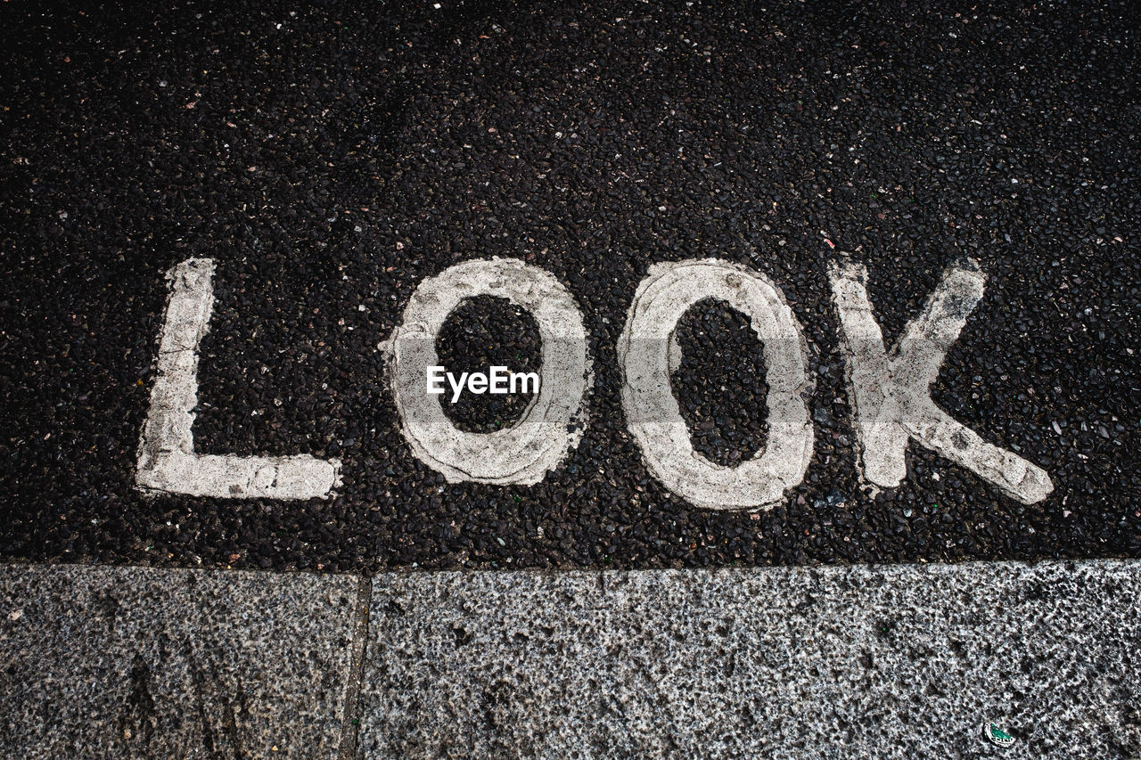 High angle view of text look on road