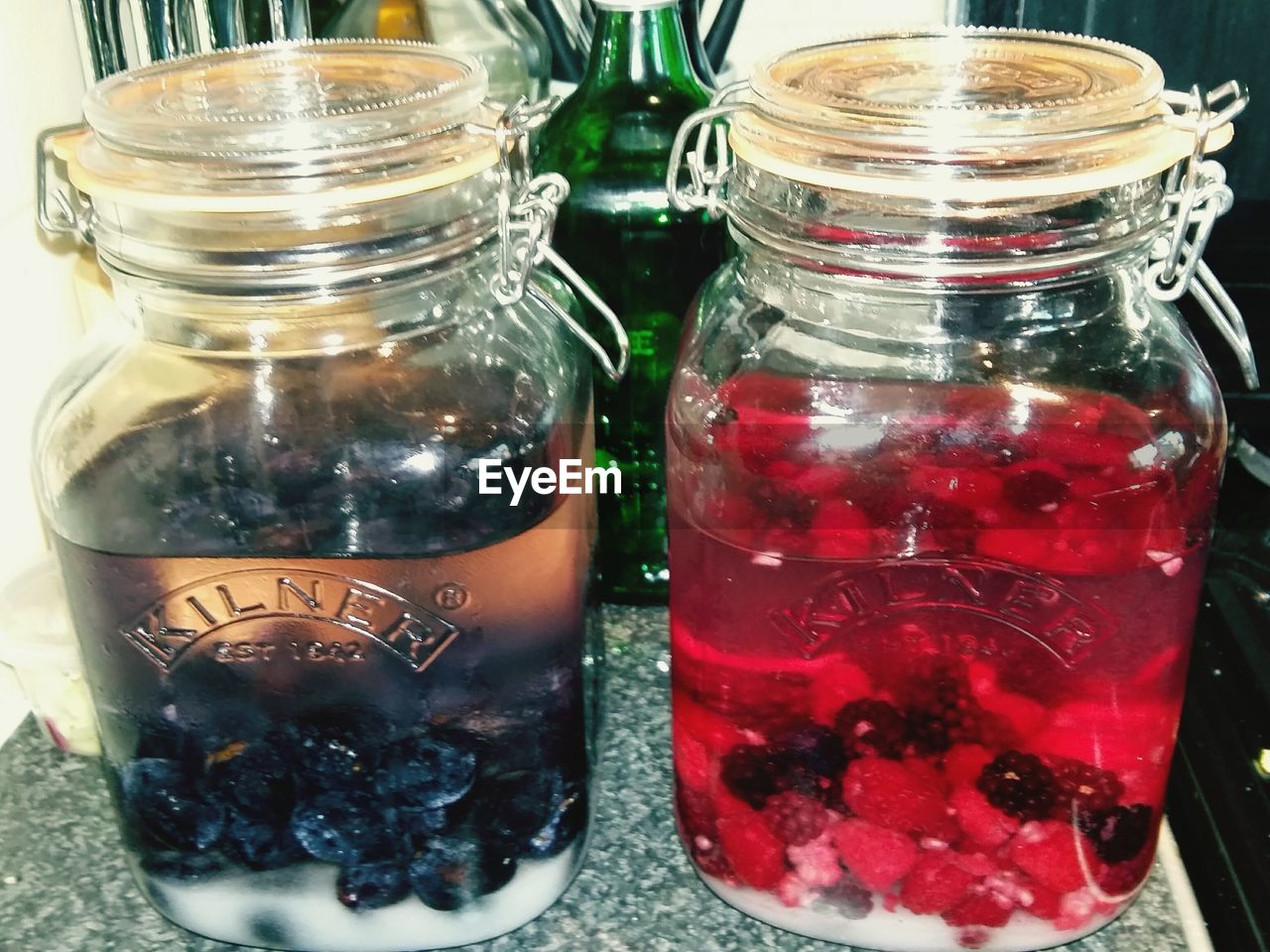 CLOSE-UP OF DRINK IN GLASS JAR WITH ICE