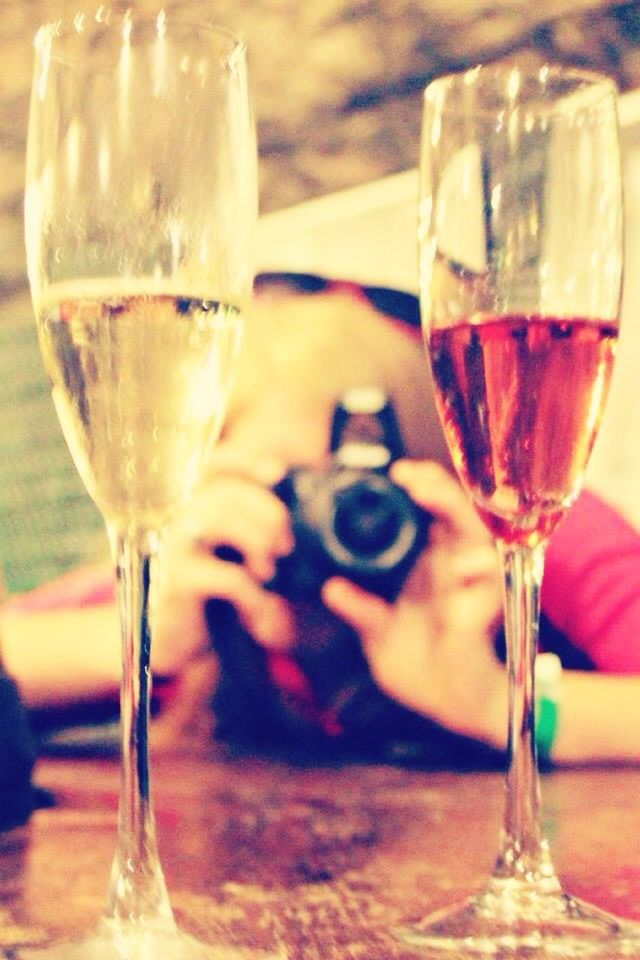 CLOSE-UP OF WINE GLASSES ON TABLE