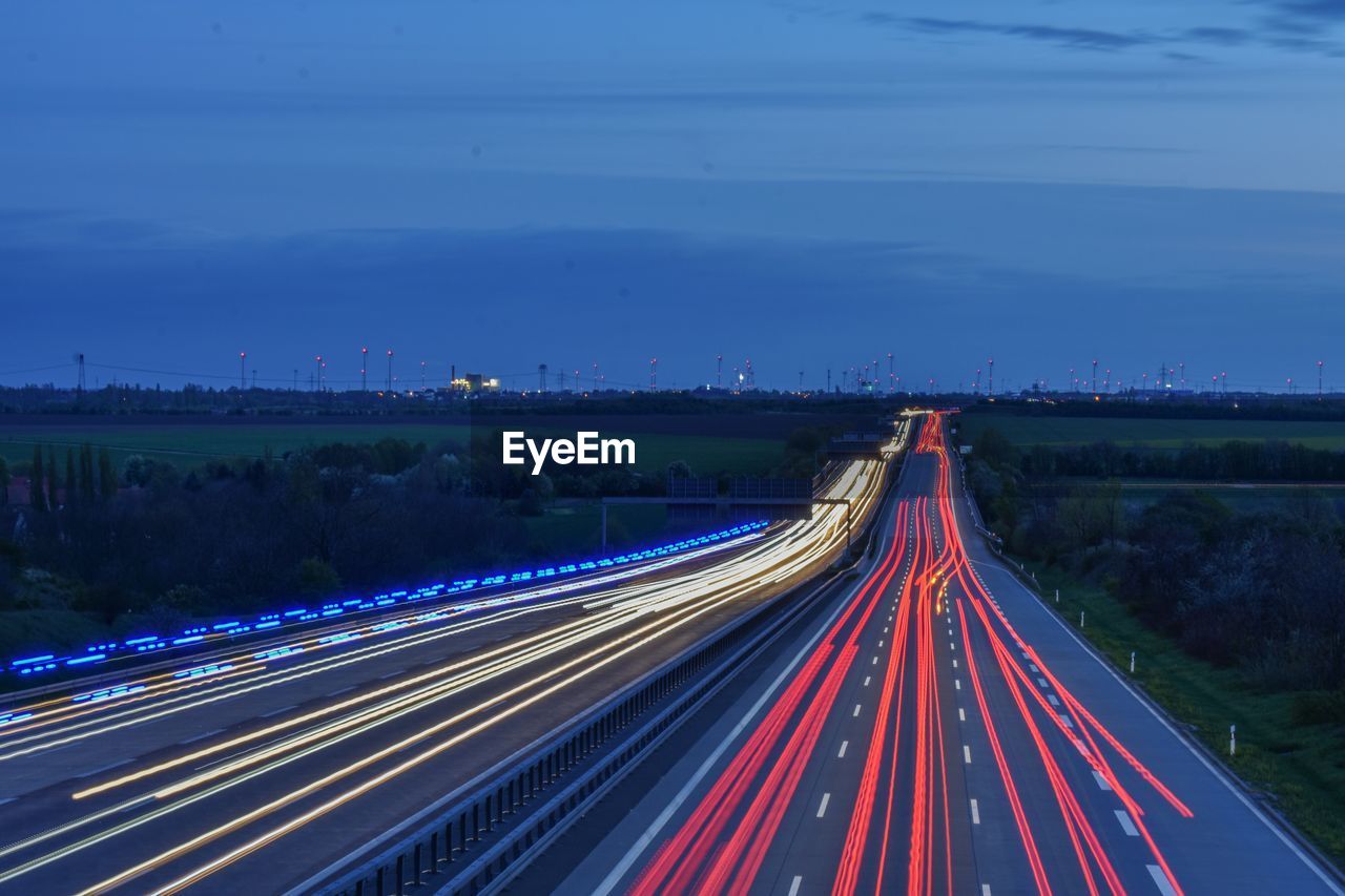 High angle view of light trails on road at night