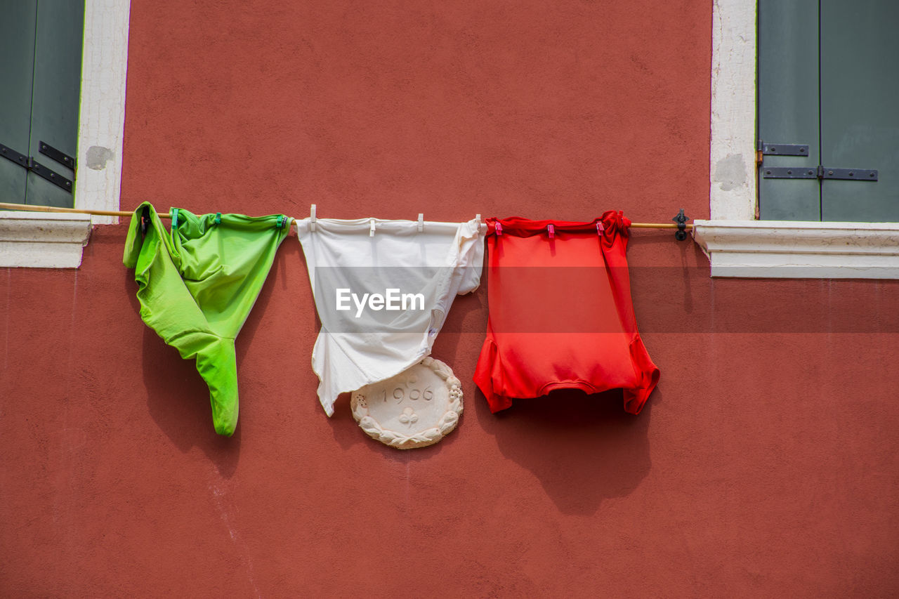 CLOTHES DRYING ON WALL