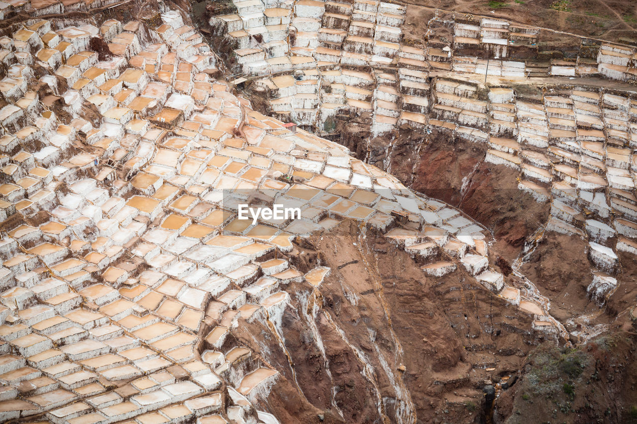 HIGH ANGLE VIEW OF STONE WALL ON ROCK