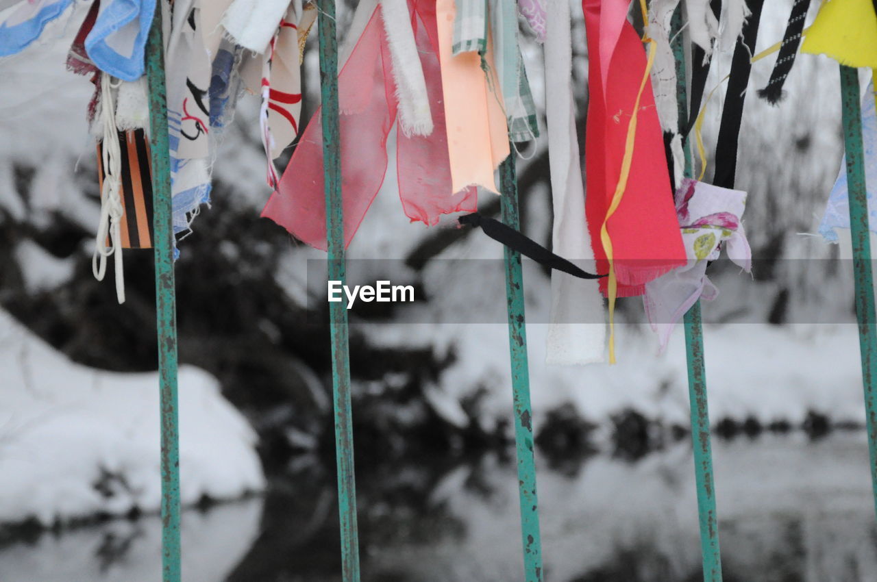 Close-up of clothes hanging on snow