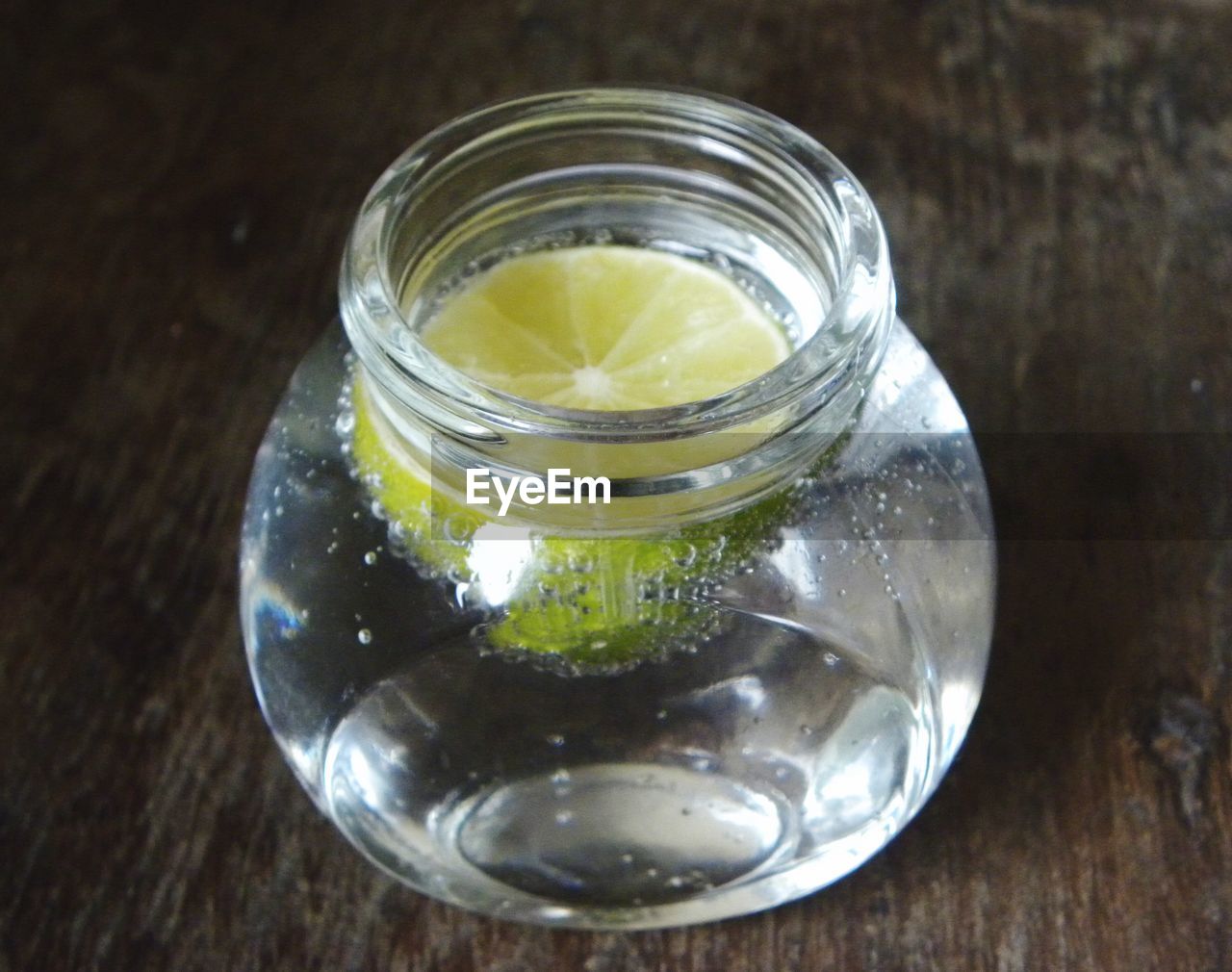 CLOSE-UP OF GLASS JAR ON TABLE