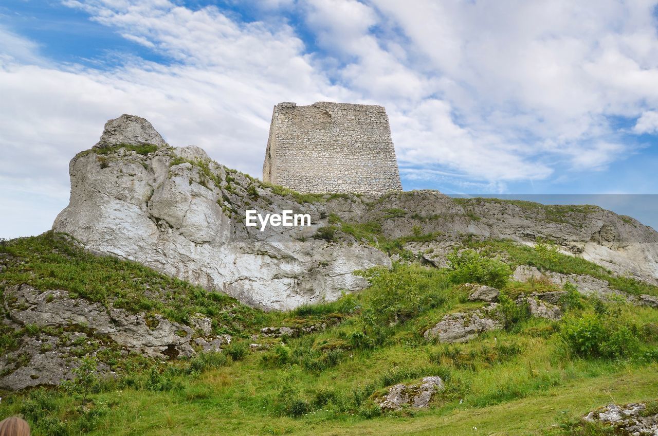 Low angle view of rock formation against sky