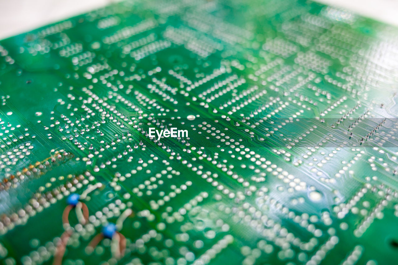 green, circuit board, computer chip, electronics industry, industry, technology, selective focus, close-up, computer, computer equipment, complexity, no people, internet, business, indoors, motherboard, computer network, communication, electronic engineering, futuristic, line, computer part, number, business finance and industry, innovation, electrical network, equipment