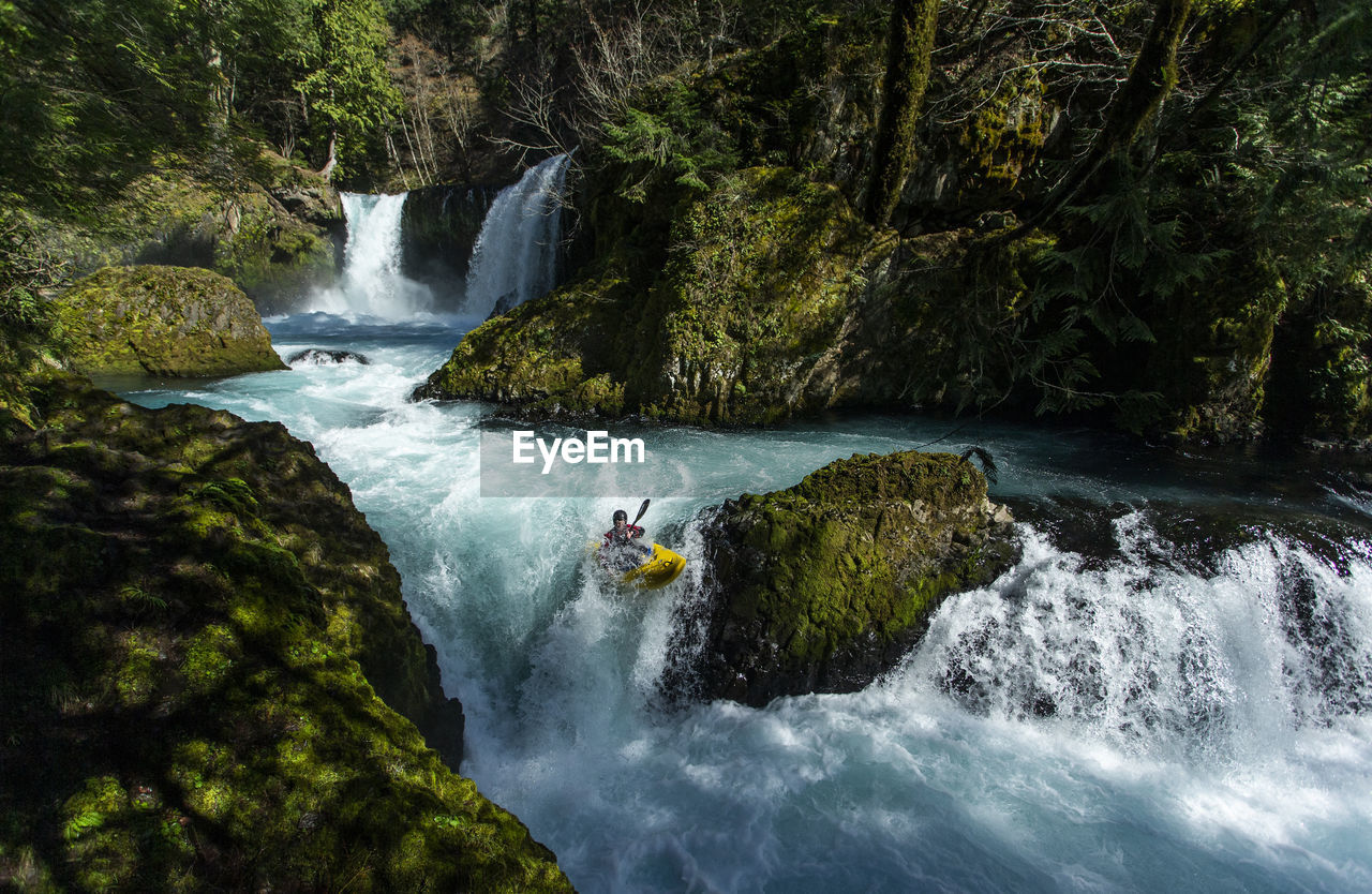 A kayaker descends the little white salmon river in the wa.