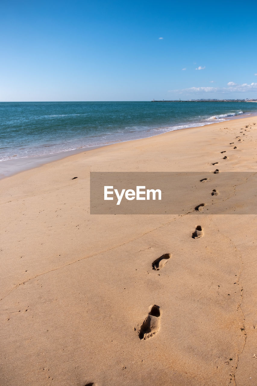 Footprints on the beach, portugal