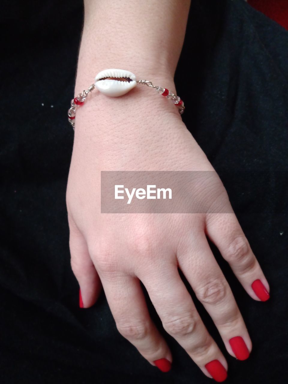 Midsection of woman wearing bracelet