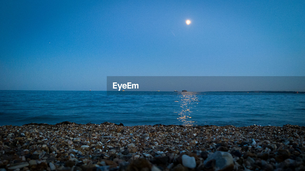 SCENIC VIEW OF SEA AGAINST BLUE SKY