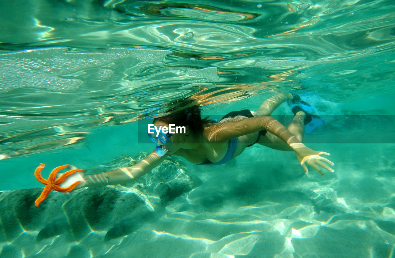 Woman swimming underwater