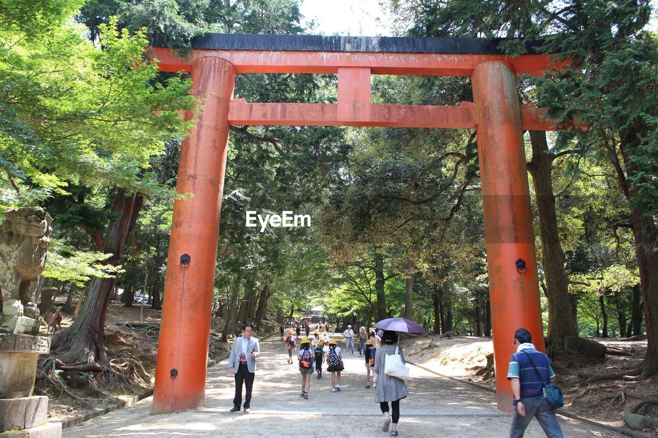 TOURISTS WALKING ON PARK