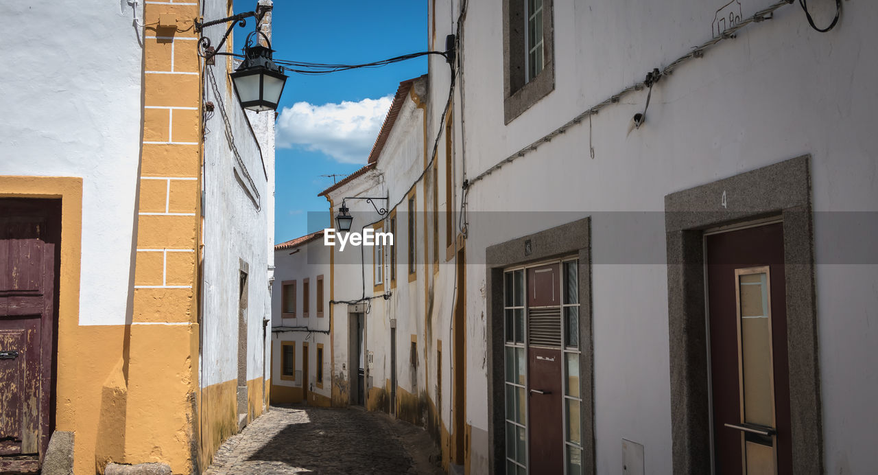 NARROW STREET AMIDST BUILDINGS