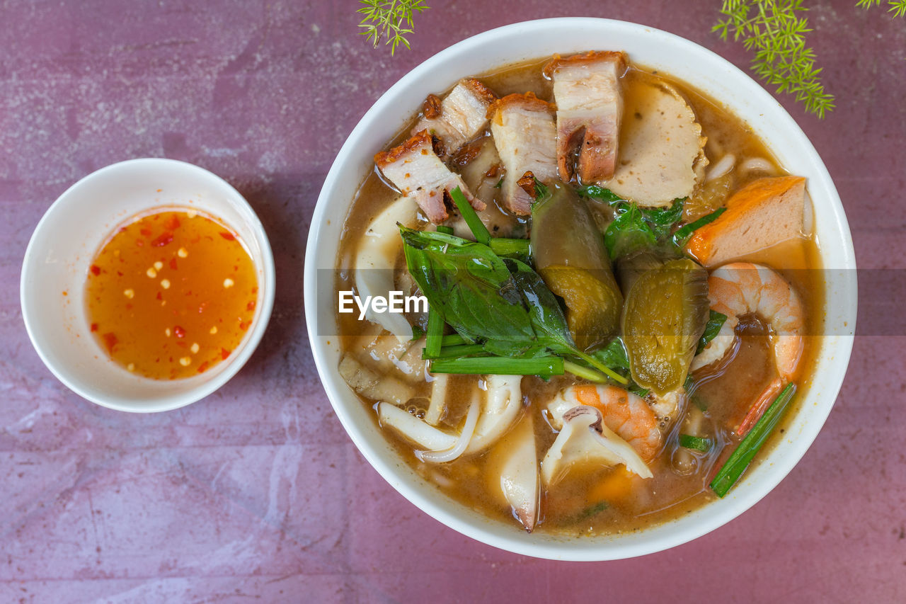 Bowl of colorful and delicious vietnamese seafood noodles soup