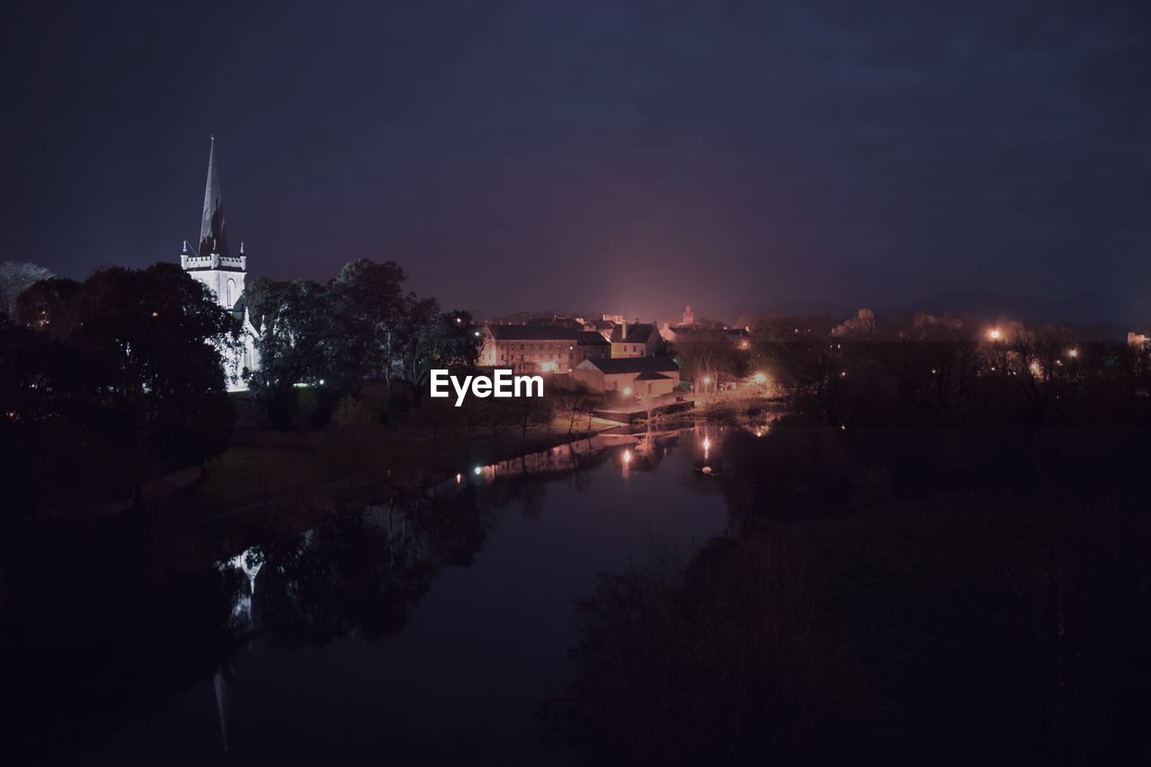 ILLUMINATED CITYSCAPE AT NIGHT