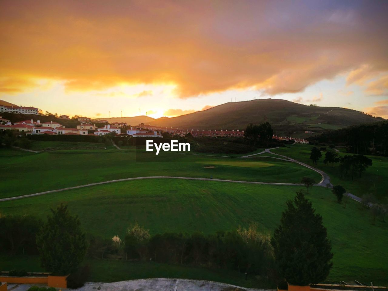 SCENIC VIEW OF LANDSCAPE AGAINST SUNSET SKY