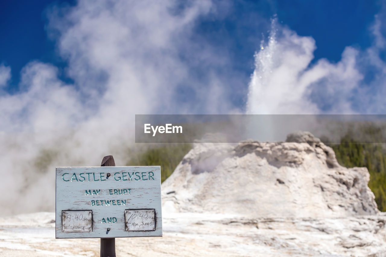 sign, communication, cloud, text, nature, warning sign, sky, landscape, mountain, environment, travel, no people, western script, day, travel destinations, outdoors, scenics - nature, information sign, land, water, beauty in nature, smoke, guidance, tourism, rock, blue, geology