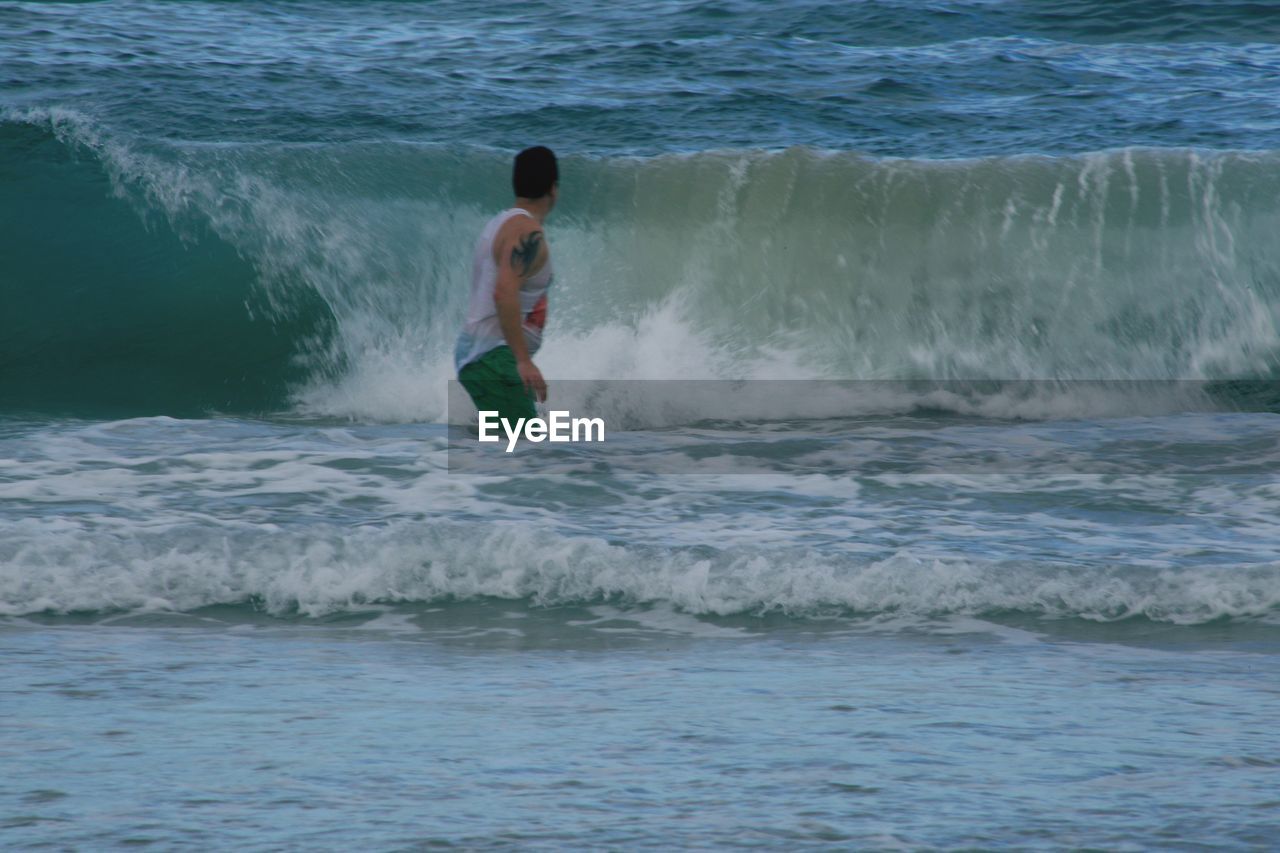 WOMAN JUMPING IN SEA