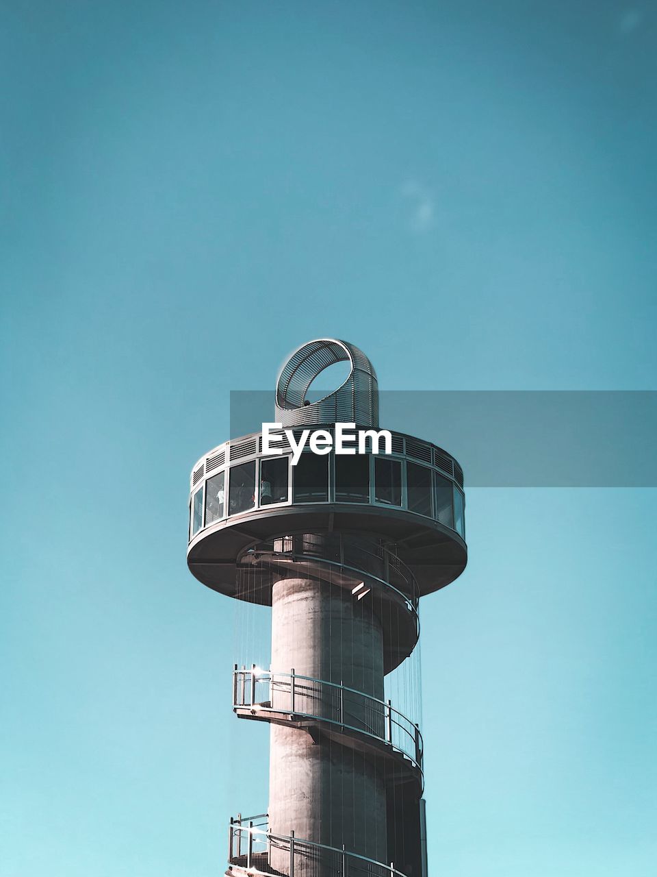 Low angle view of tower against clear blue sky