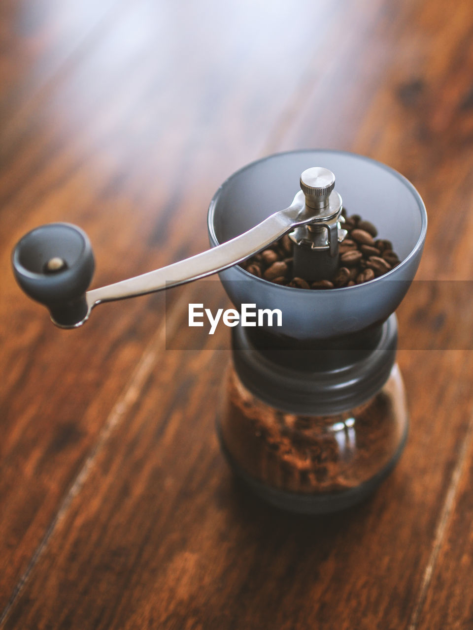 Close-up of coffee grinder on table