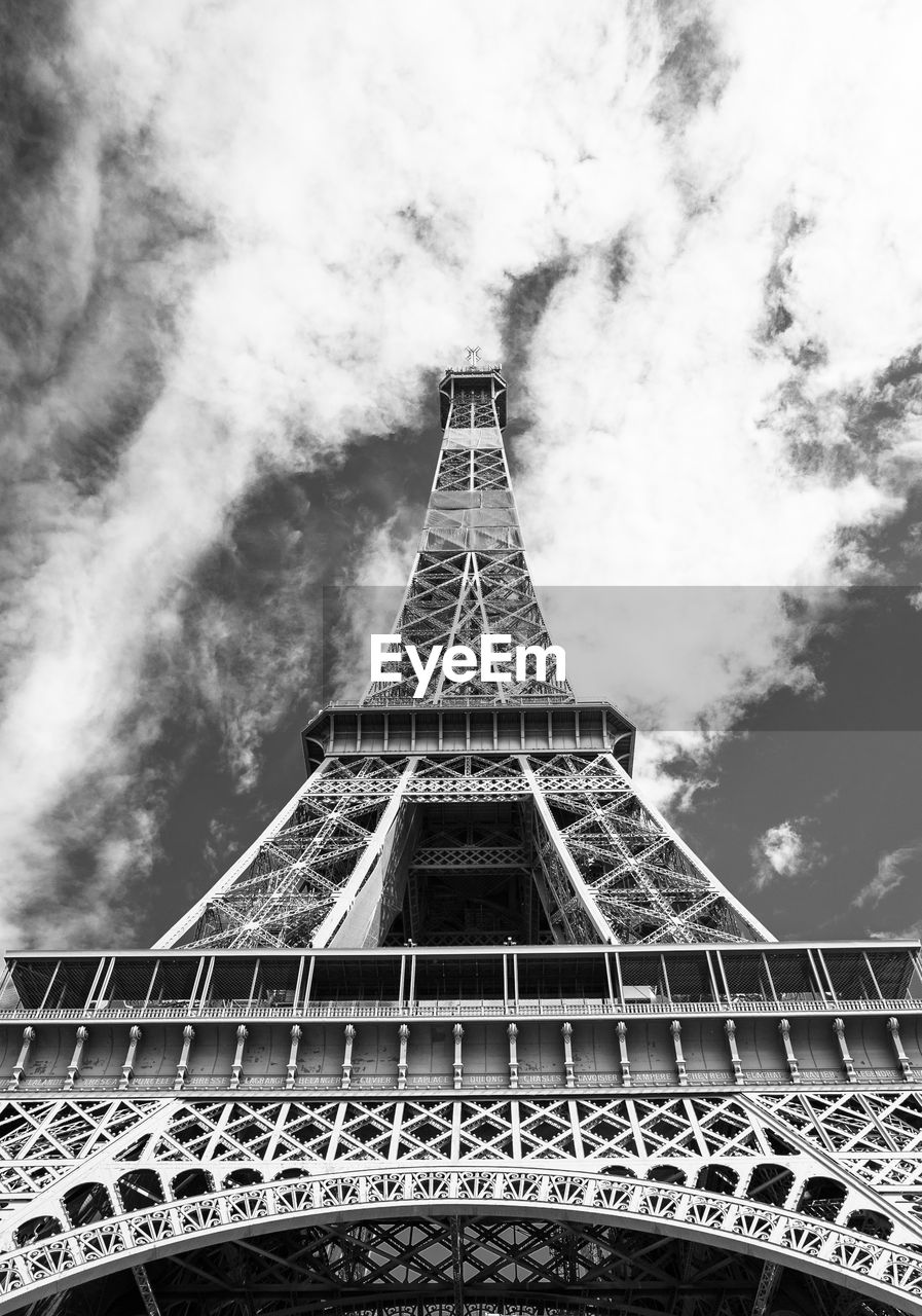 Eiffel tower under cloud sky. 