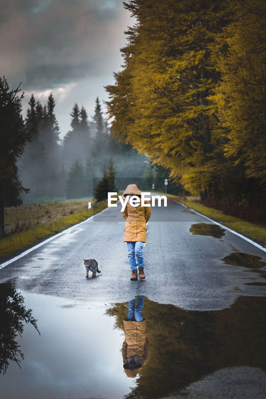 WOMAN WITH DOG ON STREET