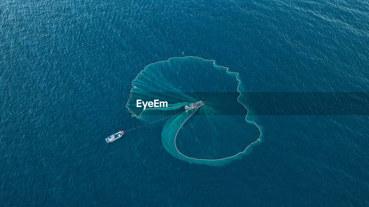 high angle view of person swimming in sea