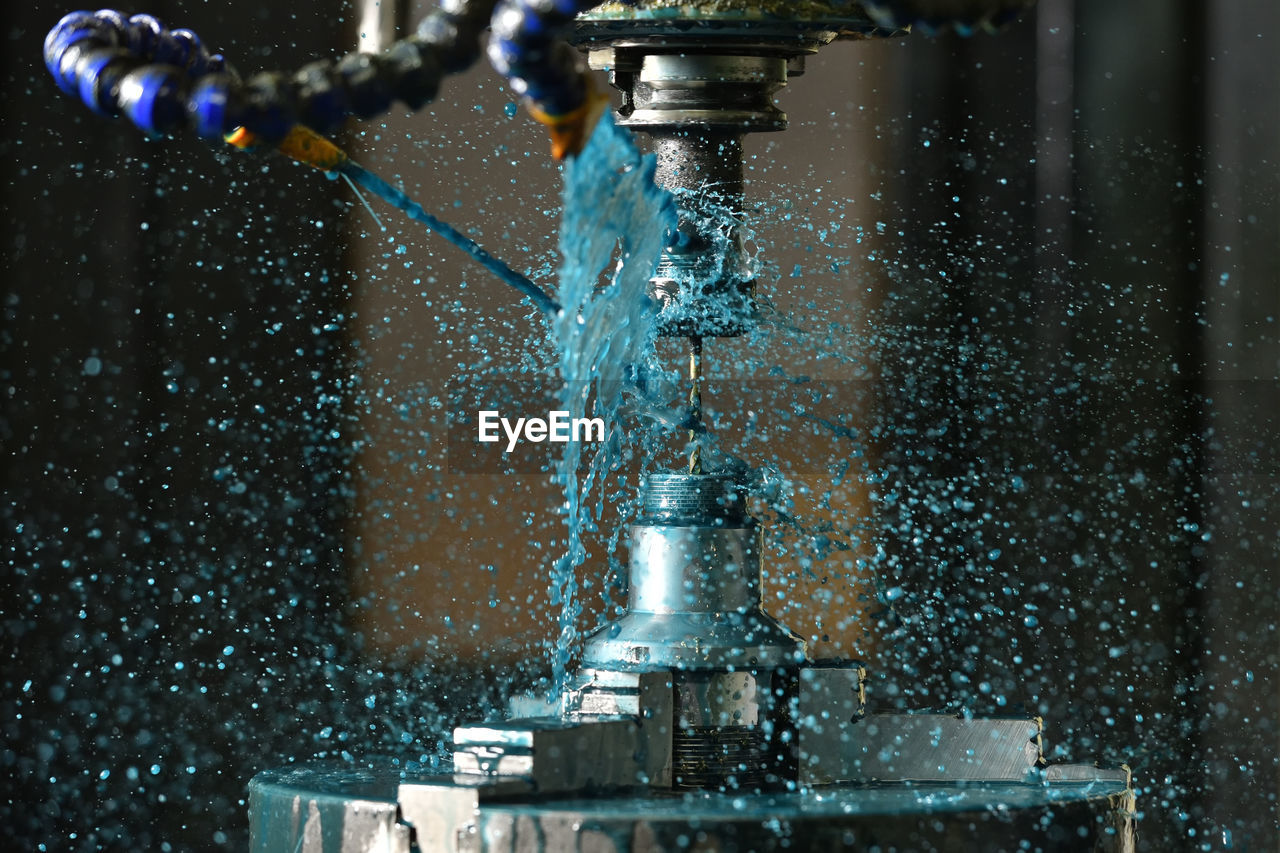 CLOSE-UP OF WATER SPLASHING IN FOUNTAIN