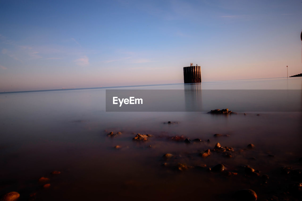 SCENIC VIEW OF CALM SEA AGAINST SKY