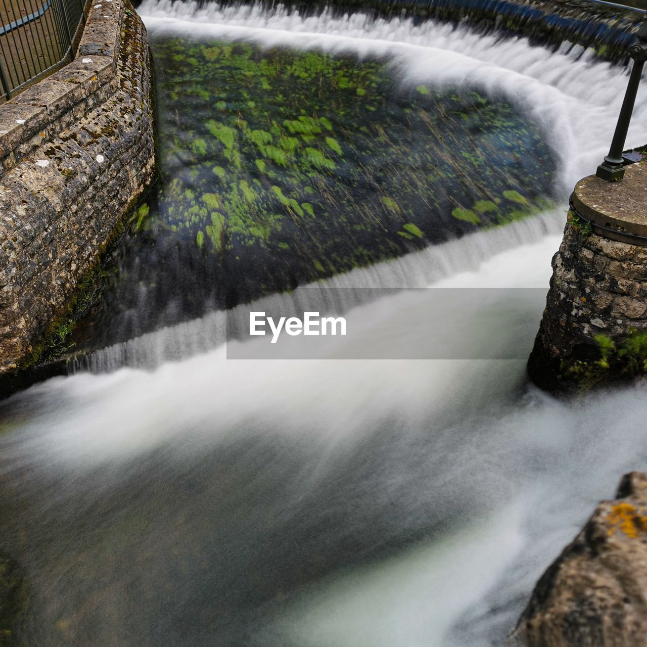 BLURRED MOTION OF WATER SPLASHING ON ROCKS