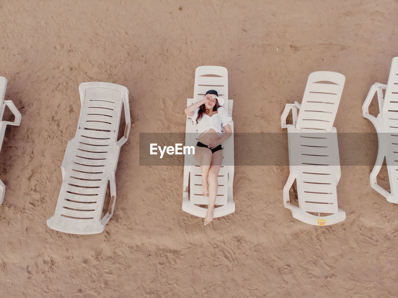 Aerial view of a girl on the beach. vacation and adventure