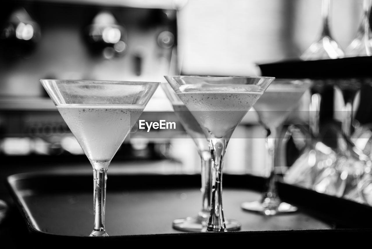 Close-up of cocktail glasses in tray