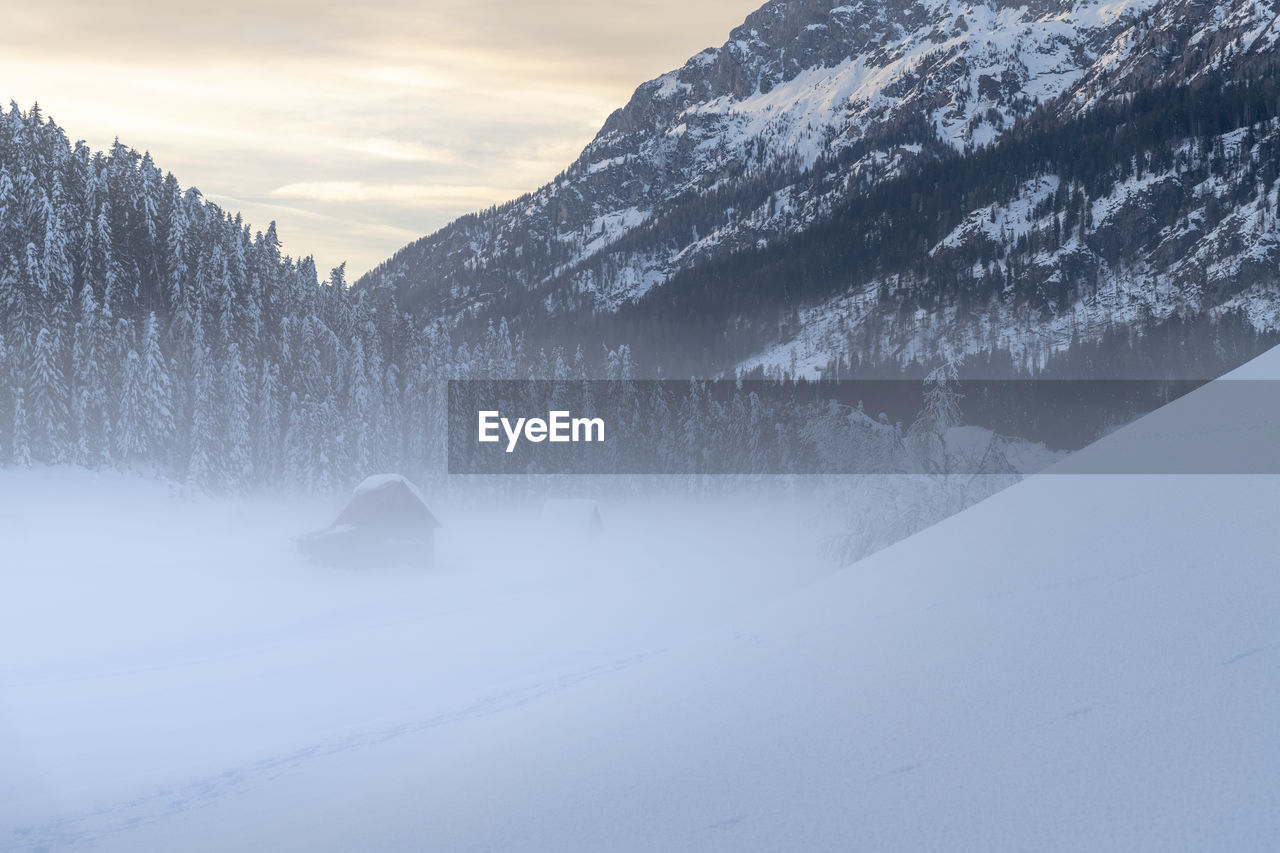 SNOW COVERED LAND AND MOUNTAINS