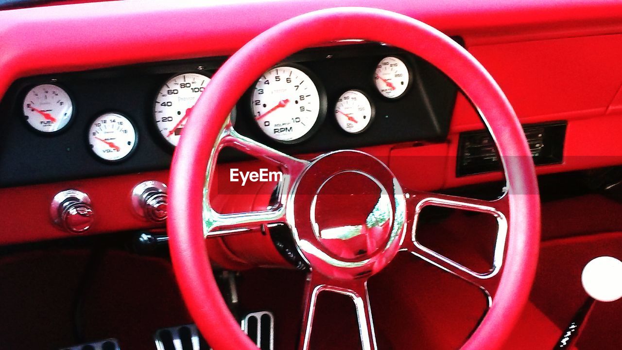 Close-up of pink vintage cars steering wheel