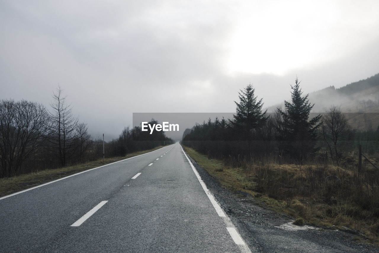 An empty country road in the mountain highlands of scotland