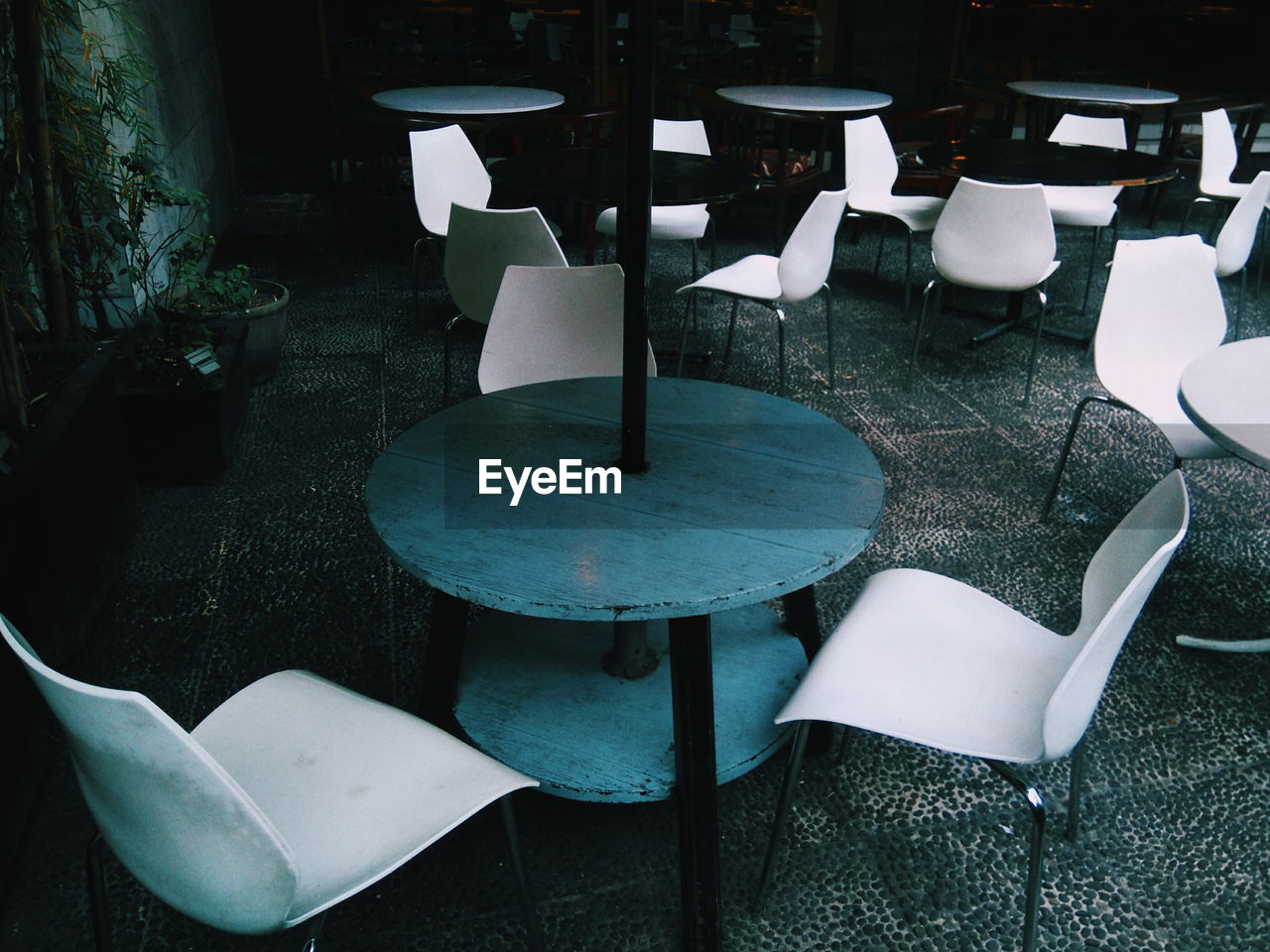 Empty chairs and table at cafe