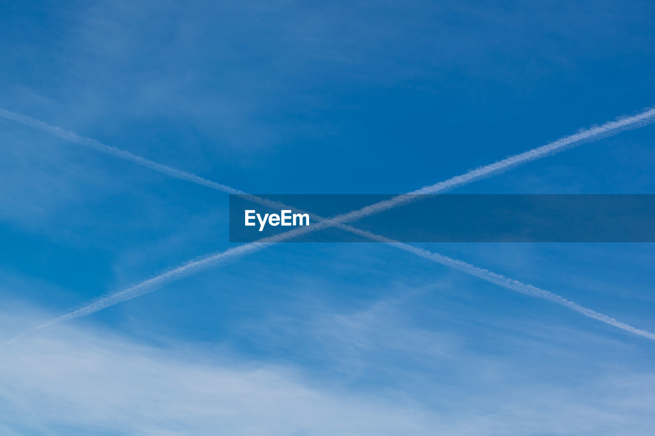 VIEW OF VAPOR TRAIL IN SKY