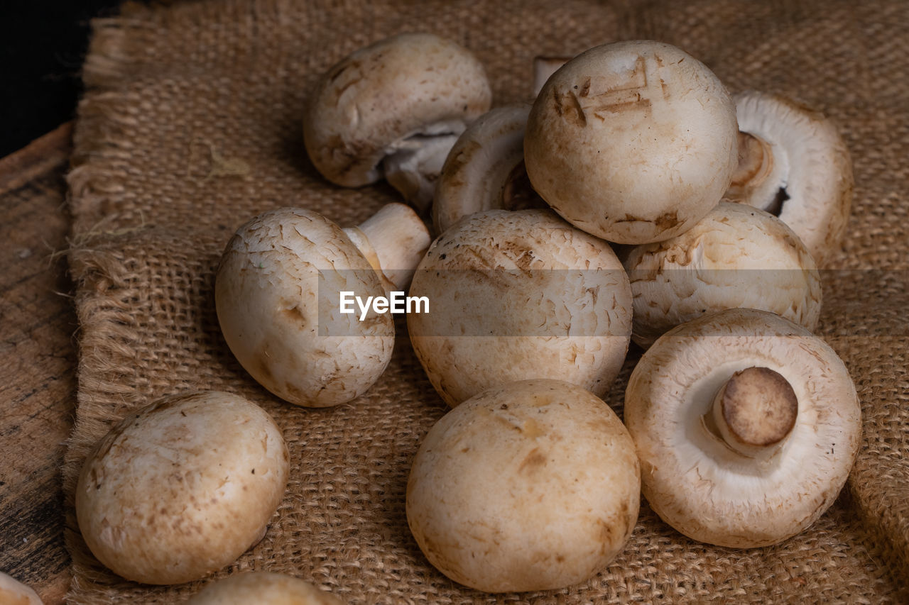 High angle view of mushrooms on the wooden table