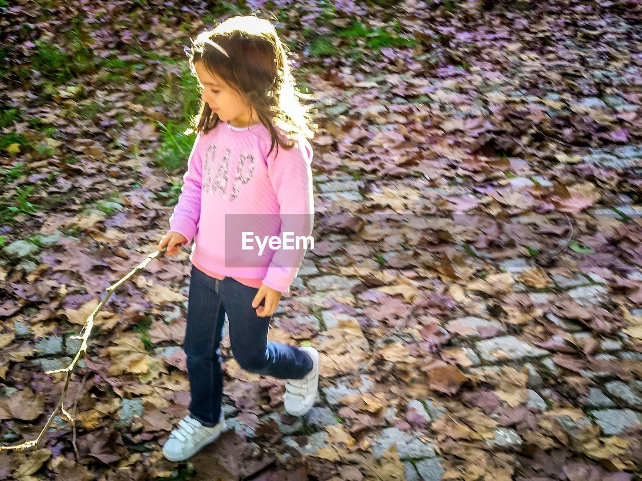 FULL LENGTH OF WOMAN STANDING ON PINK LAND