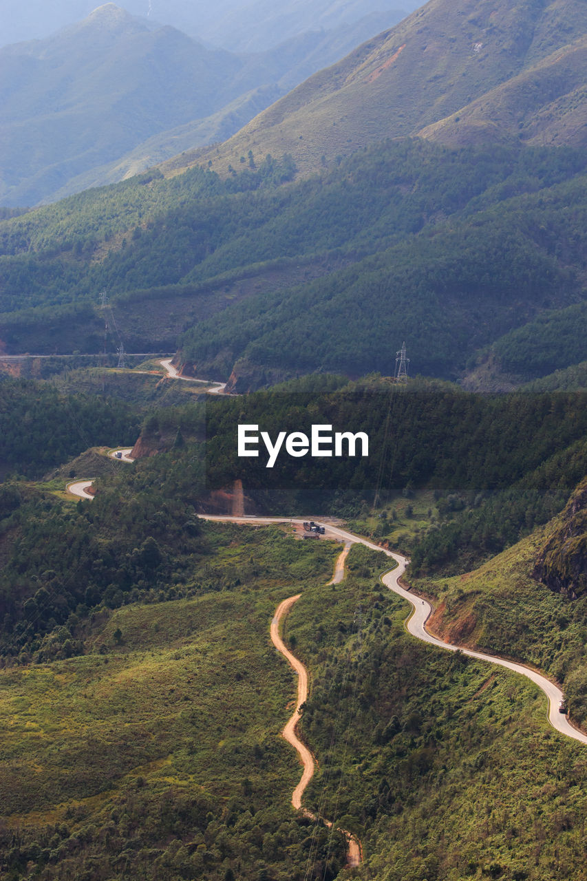 HIGH ANGLE VIEW OF ROAD AMIDST LANDSCAPE