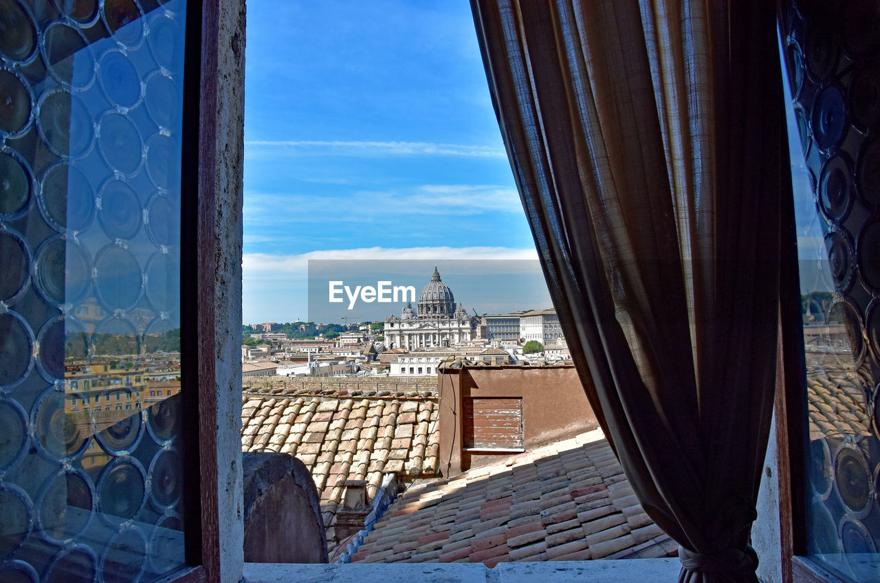 View of buildings seen through window