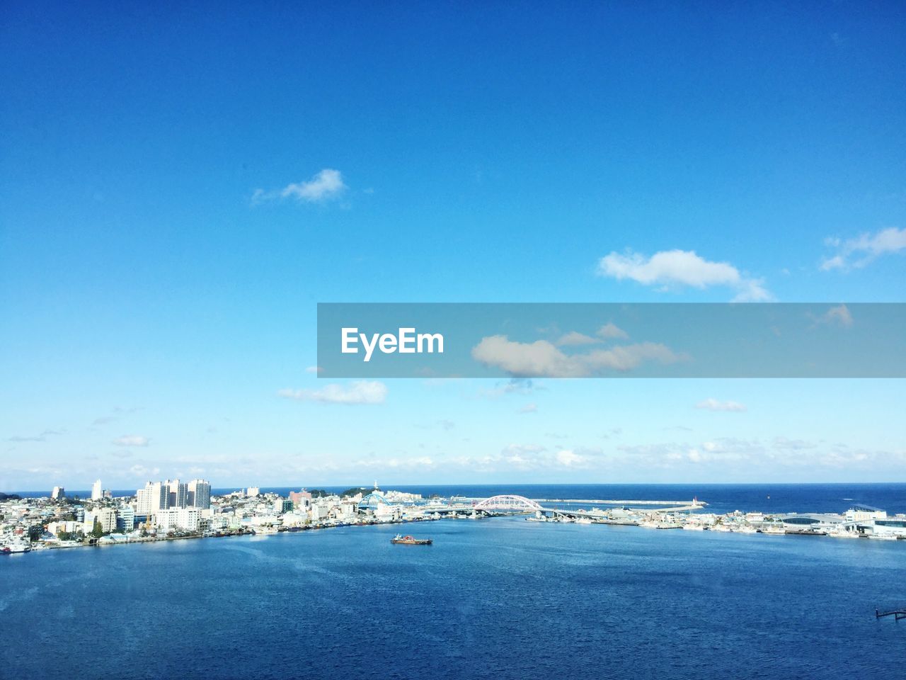 Scenic view of sea against blue sky