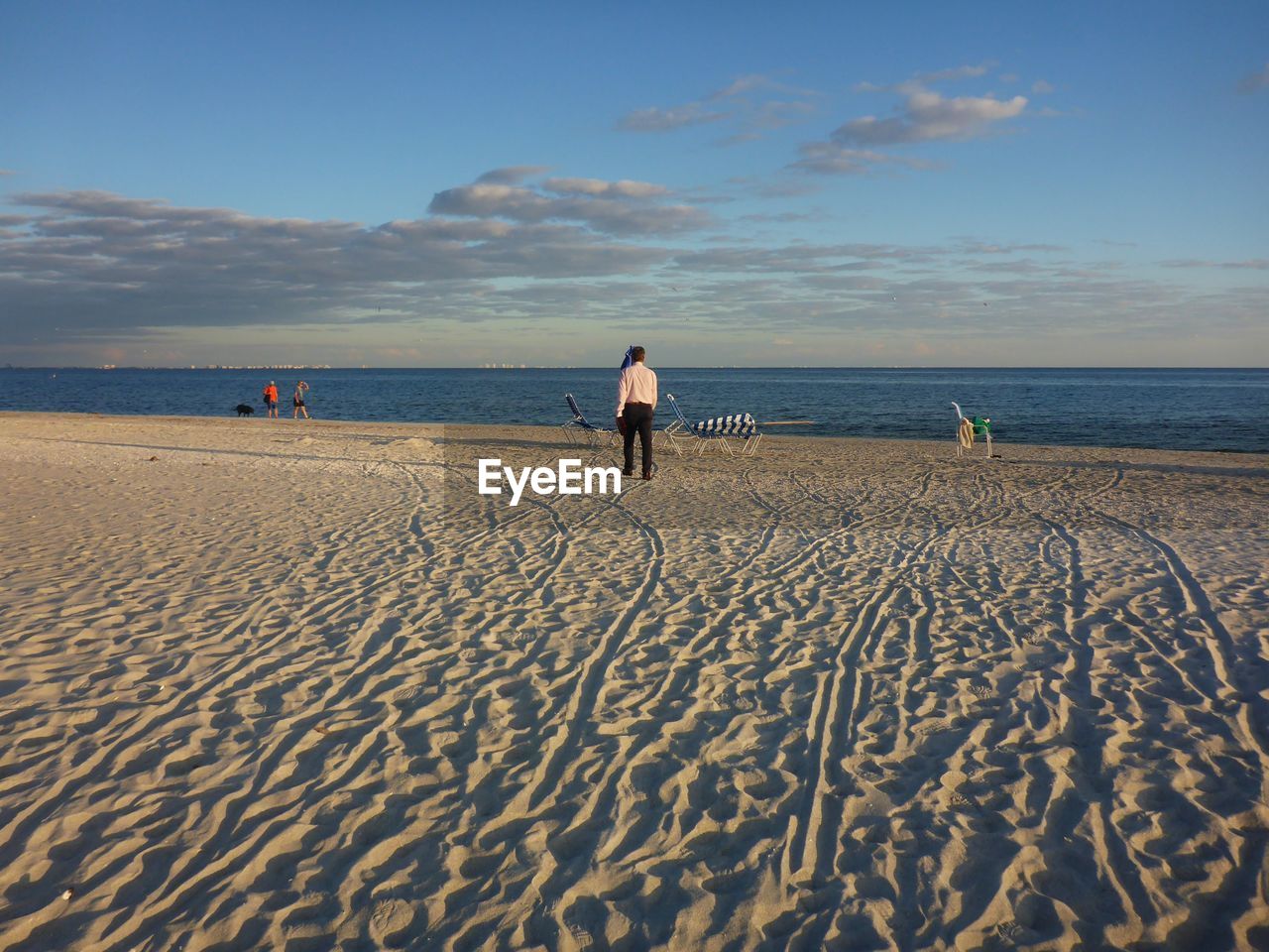 Man on beach against sky